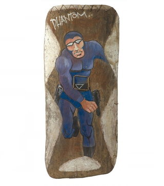 Illustration for article titled Why Does This Comic Book Hero Appear On So Many New Guinea War Shields?